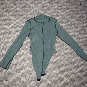 Long sleeved body suit